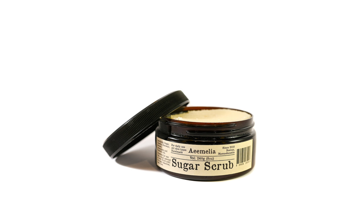 Aeemelia sugar scrub’s unique texture is packed with the nutrients of camellia seed oil and babassu oil to perfectly hydrate your skin. Black screw top lid on 16 oz or 8 oz amber plastic jar with white and black label.  Suitable for all skin types (including sensitive skin).